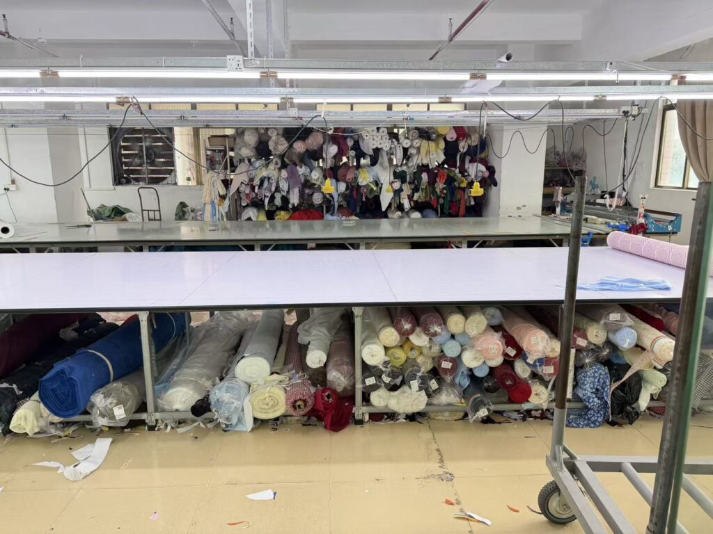 Garment workers sewing clothing production