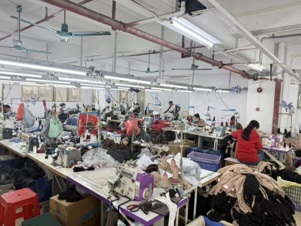 Garment workers sewing clothing production