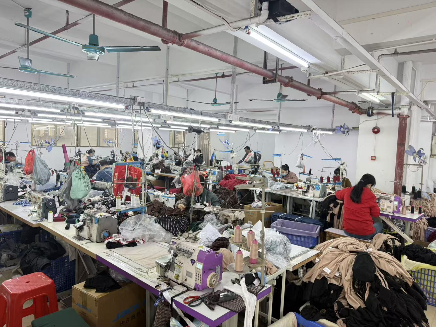 Garment workers sewing clothing production