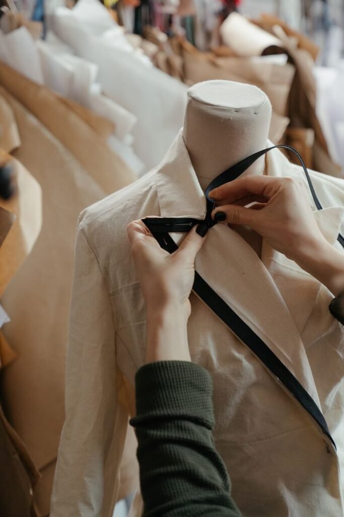 Custom clothing manufacturer checking garment quality before production