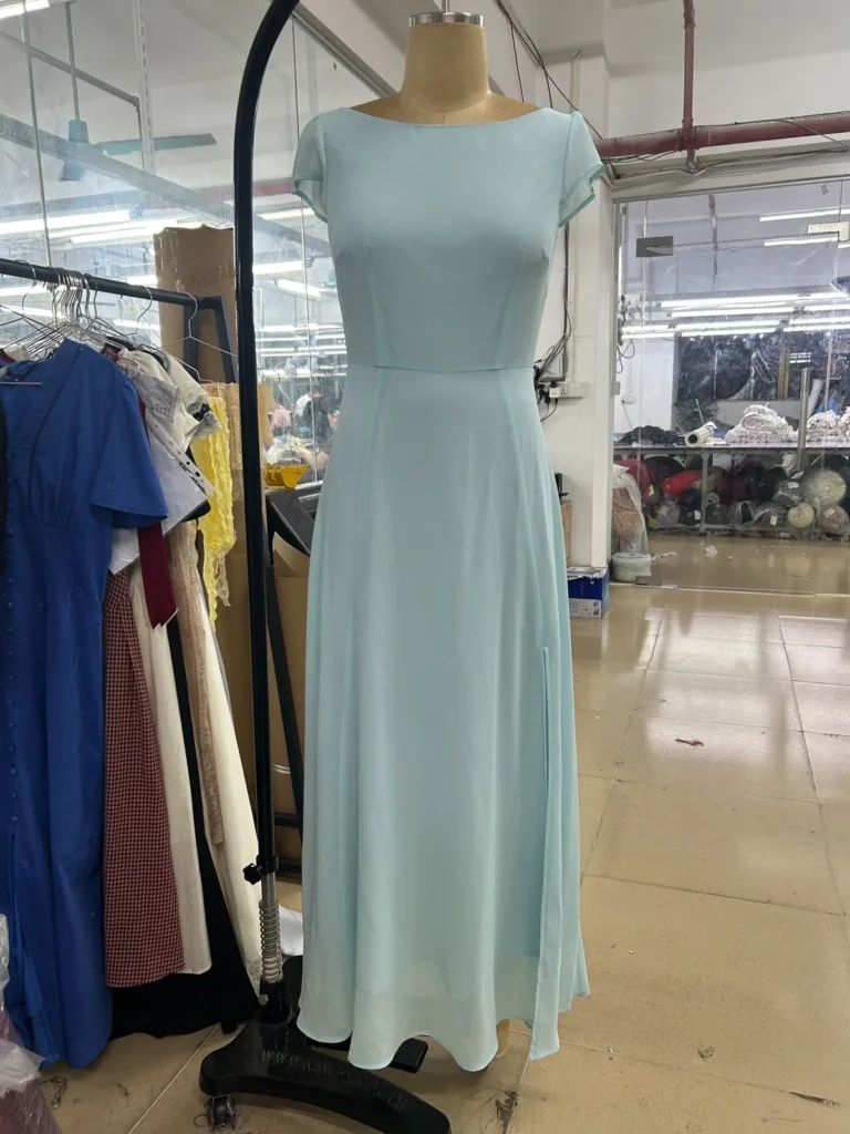 Light blue cap-sleeve midi dress with a fitted waist and flared skirt on a mannequin.