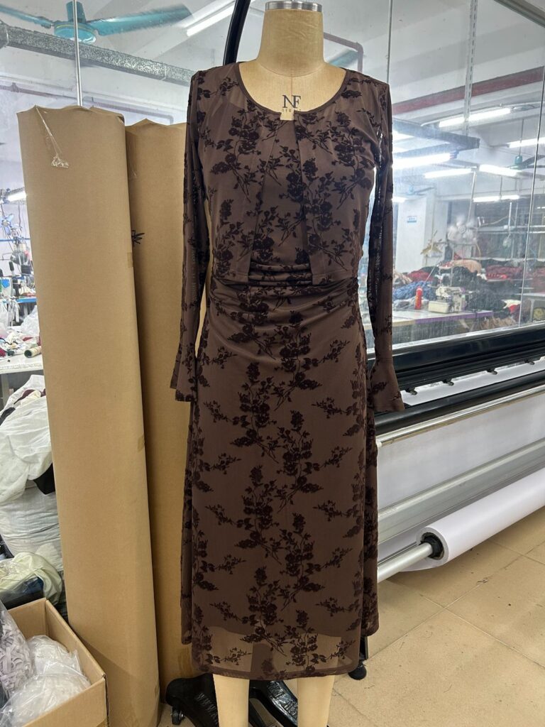 Brown floral sleeveless dress displayed on a mannequin
