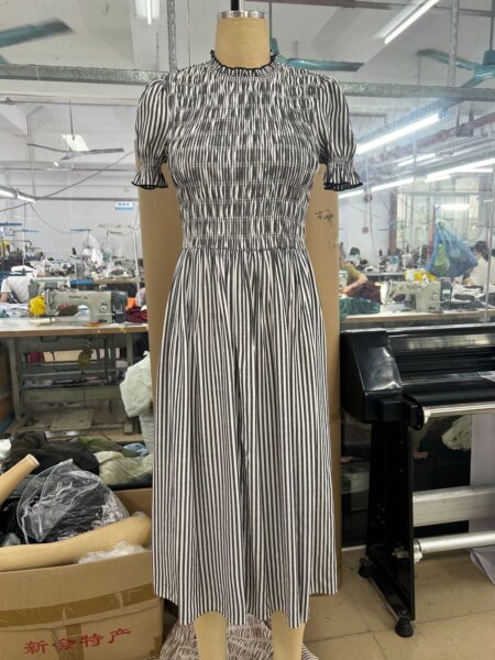 Striped smocked midi dress sample with gathered bodice and flared skirt