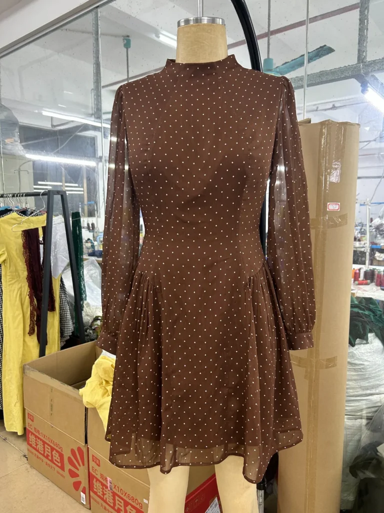 Brown small-print long-sleeve mini dress with a high neckline on a mannequin
