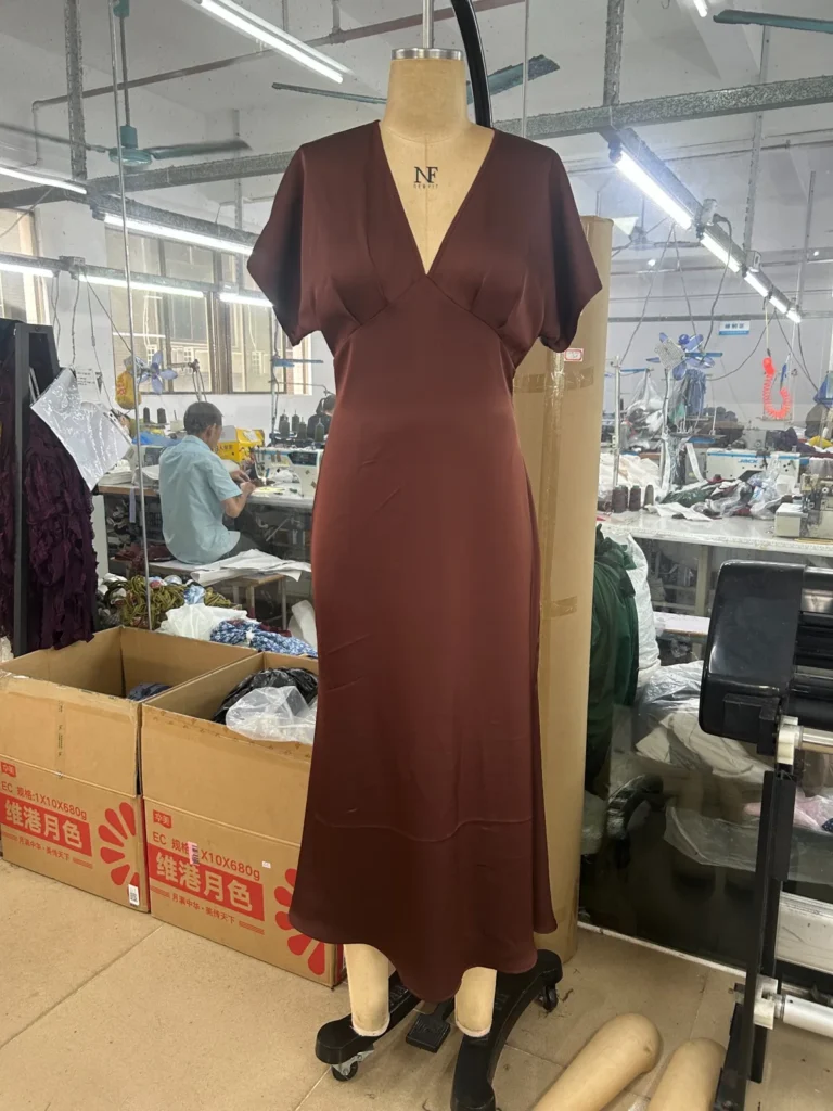 Brown V-neck short-sleeve midi dress on a mannequin